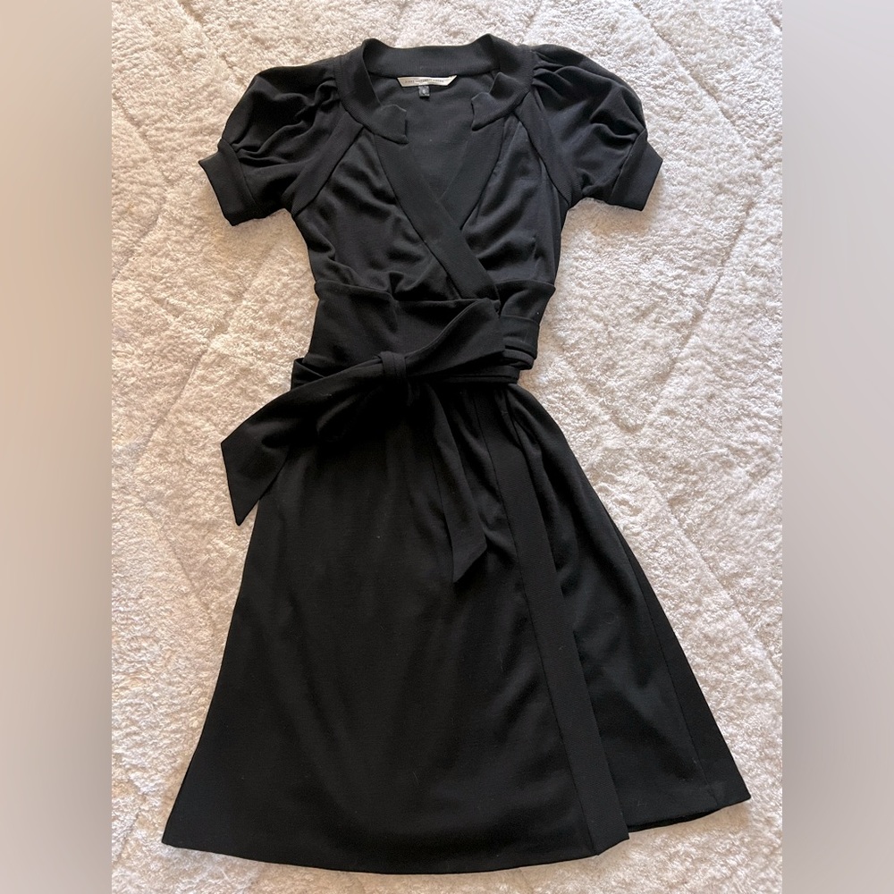 Diane Von Furstenberg black short sleeve wrap dress.